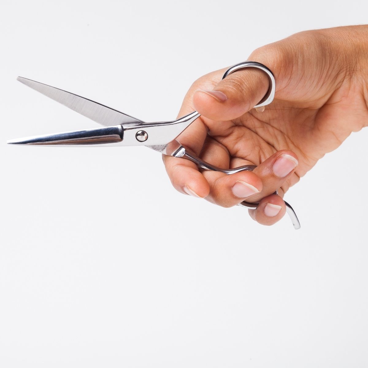 A hairstylist demonstrating the ergonomic offset Ichiro handle