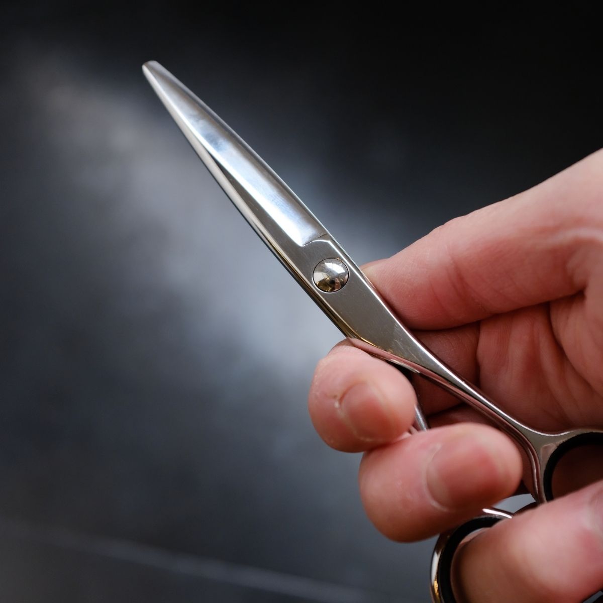 A left handed scissor handle design